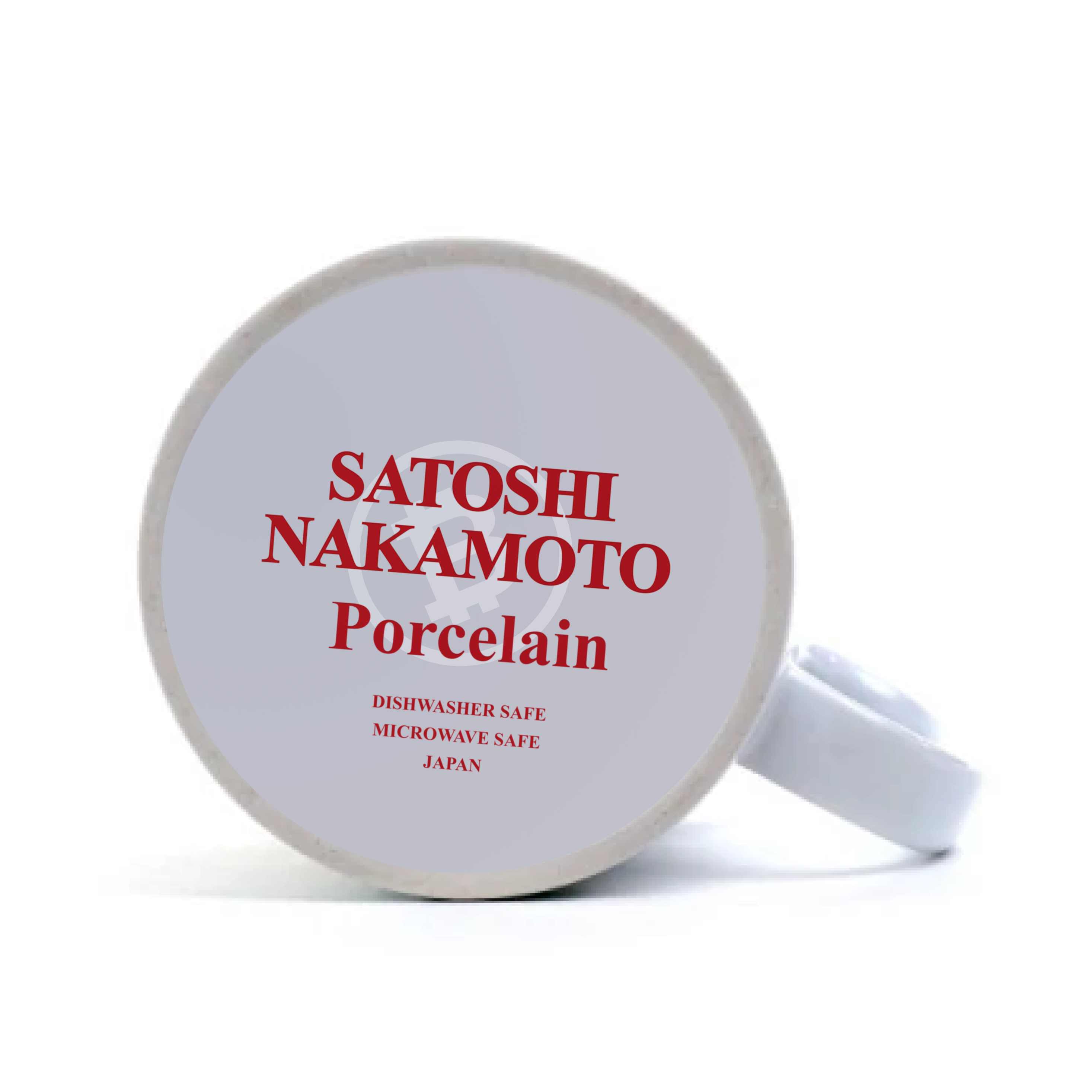 Coffee mug laying on its side to show the underside. The red print on the bottom says Satoshi Nakamoto Porcelain Japan. The Bitcoin logo is printed in white behind it.